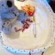 Notice the little red bag with it's ribbon bottom sewn directly to the base fabric.