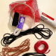 You may want elastic and also fabric for an interior pocket. Old lanyards can be cut for cording, or use shoestrings or clothesline.