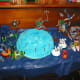 Lego Party Cake. Let the guest help decorate the birthday cake. Use the Lego creations the kids make on and around the cake.