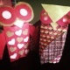 Two very different owls—a very simple design done on a red bag (left) vs. a highly decorated owl on a brown bag that you can't even see anymore.