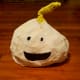 A grinning face emoji pumpkin.