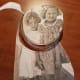 This is my aunt and her cousin as little girls. I've cut a round shape from the copy of the old picture. Now I'll glue it onto a plastic piece that I had (an old drink coaster).