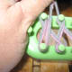 When you get to the end, turn loom around, and wrap pegs as shown. Then pull yarn straight across and hold for a moment.