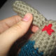 Stitching arms on.