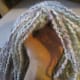 Hooked hair down either side of the stitched in the part.