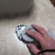 Wipe the residual grout off of the glass