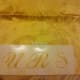 Place stencil on cloth napkin and secure with several pieces of tape.