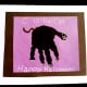 A black handprint makes a cute halloween cat.