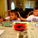 Paint over designs with watercolor paint and set pictures aside to dry.