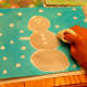 Scrape the rubber cement off to reveal the protected designs.