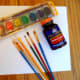 The supplies to create rubber cement art.