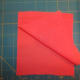 Two pieces of fabric, right sides together, ready to be pieced (sewn) together.