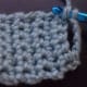 To make buttonhole, chain several stitches where you want the hole to be and skip that number of stitches before continuing your row.