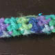 Single crochet or half double crochet around until bracelet is the size you want. Then fasten off, sew ends together.