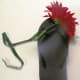 Use floral tape to securely fasten the flower stem to the top outside of the flip flop.