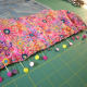 Pin all the way across, making sure the edges of the fabric and the denim are aligned.