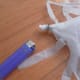 Insert the end through the coin and use a lighter to melt the plastic under the coin.