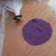 Use a small piece of fabric to wrap around the coin and tape the fabric in place.