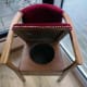 When seat lifted, access to the old commode, now converted to storage space.