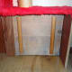 Cat flap insulator upholstered with carpet to keep the draughts out.