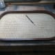 Using the back rest as a template to cut plywood.