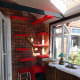 Cat tree upholstered with red faux fur