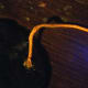 Yarn hot glued onto the back.