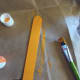Popsicle stick painted orange.