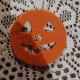 The face cut out of the orange circle.