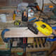 Marking out and using a jig saw to cut the central drawer pull in one of the drawer fronts