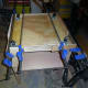Gluing and clamping the decorative plinth side pieces in place