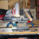 Cutting scrap wood to size for the sides of the housing for the plinth drawer