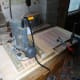 Using the jig to route the divider slots in the drawer sides