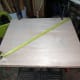 Mark the last edge, and check for squareness by measuring diagonally before cutting.