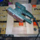 Sanding the drawers smooth with an orbital sander