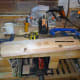 Using the first drawer as a template to mark out and cut the other drawer pulls