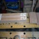 Applying the wood glue and tapping the dowels in place