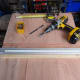 Using a straight end guide to fit the first drawer support in place