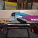 Using a belt sander to make the edges straight for a good fit.