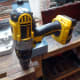 Drilling pilot holes in shelf supports, ready for screwing in place.