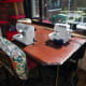 Repurposed table in situ, in our conservatory, with sewing machine and overlocker out and ready for use.