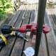 Cutting chrome bar to the correct length for legs.