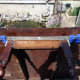 Clamping and gluing table’s side skirts before fitting proposed arm supports to them.