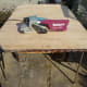 Table top sanded back to bare wood with belt sander.
