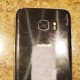 Place a piece of sticky back velcro the back of your old smartphone.
