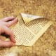 Tear out 12 pages from your old book. Roll each page starting from the bottom right corner to the top left corner.