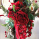 A Victorian Tussie-Mussie Of Red Roses And Pine