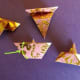 Turn all folded tiles over and position like the tile on the lower left. Fold down the longer side to meet the short side. The arrow indicates your new crease. Your tile will look like the one on the lower right.