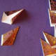 With right side down, fold each side of the tile in, meeting the diagonal crease in the center.