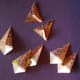 Fold the wide point up as shown with the two upper tiles.